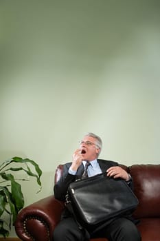 Man using breath freshener