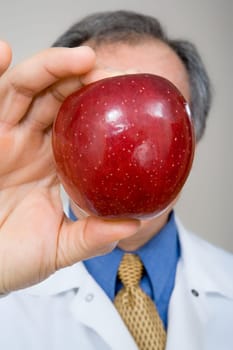 Dentist holding apple