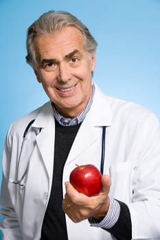 Doctor holding an apple