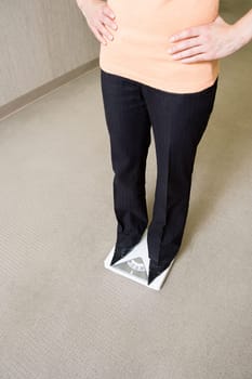 Woman weighing herself