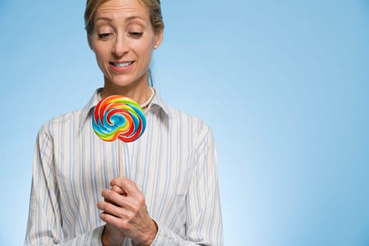 Woman holding a lollipop