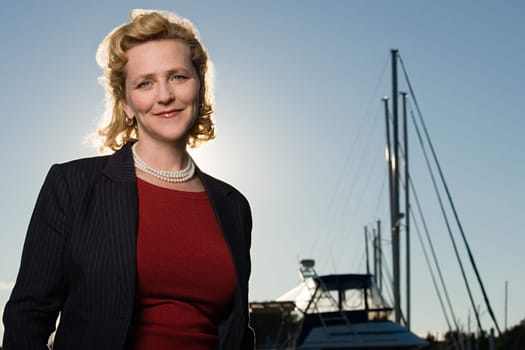 Mature woman by yacht