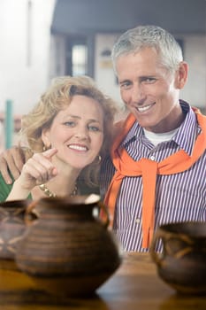 Woman looking at pottery