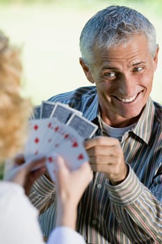 Man and woman playing cards