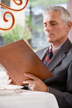 Man looking at a menu