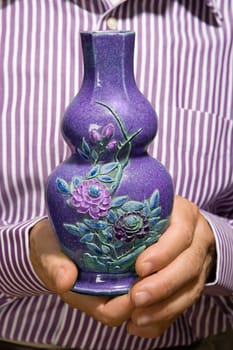 Man holding a vase