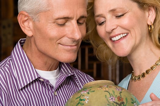 Couple looking at vase