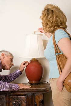 Couple looking at lamp