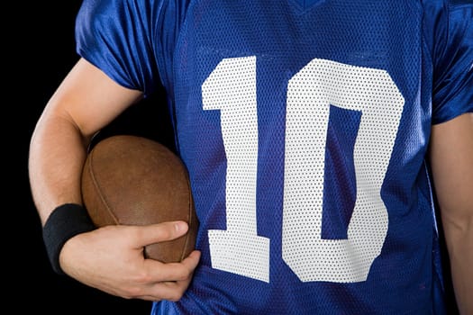 Man holding American football