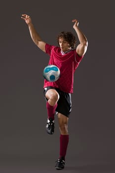 Footballer playing keepy uppy