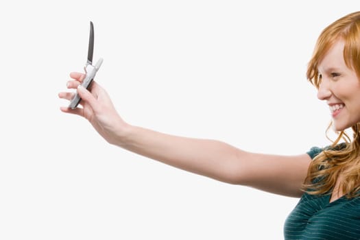 Woman photographing with cell phone