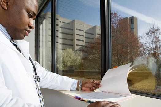 Doctor looking at paperwork