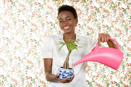 Woman watering houseplant