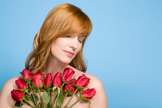 Woman holding bunch of roses