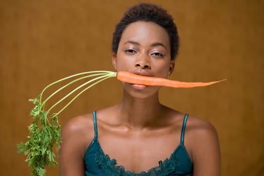 Woman with a carrot in her mouth