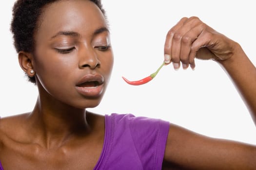 Woman holding chili pepper