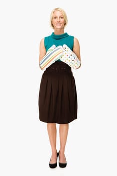 Woman wearing oven gloves