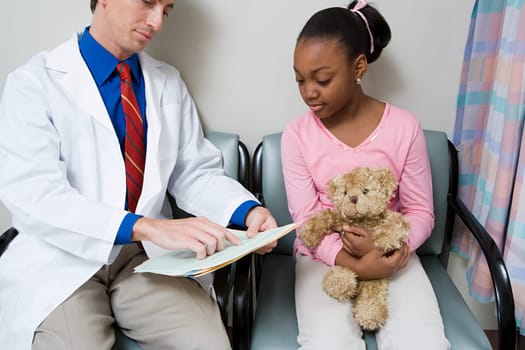Doctor talking to girl