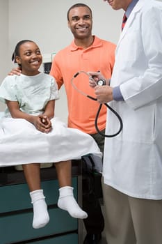 Girl with father and doctor