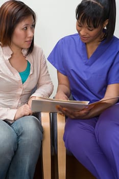 Nurse sharing information with patient