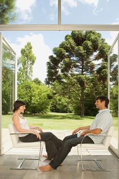 Couple sitting on chairs