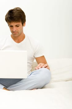 Man frowning at laptop computer