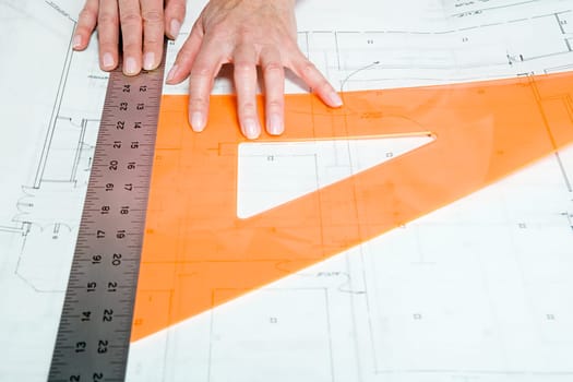 Architect using rulers