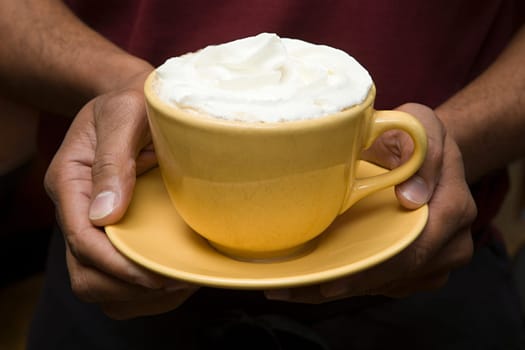 Person holding hot chocolate