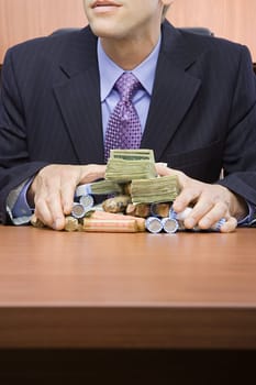 Businessman holding stack of money