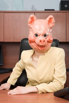 Portrait of businesswoman in a pig mask