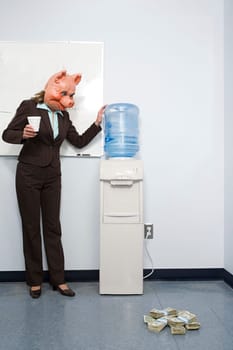 Businesswoman in pig mask looking at money
