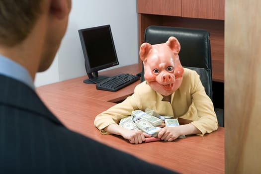 Businesswoman in pig mask holding money