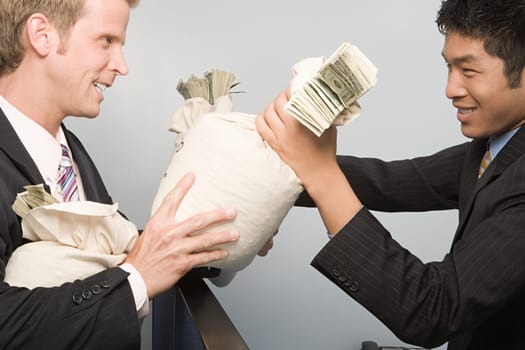 Businessmen passing money