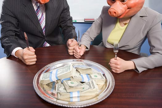 Businesspeople in pig masks sat in front of money