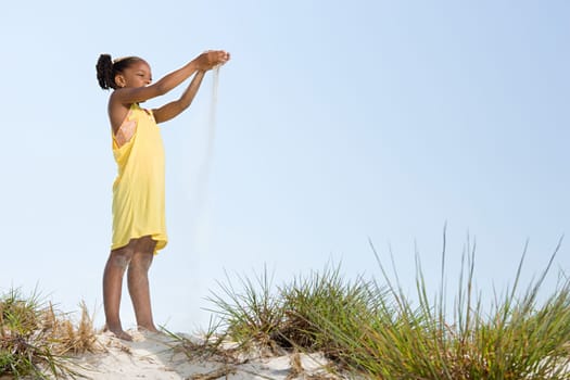 Girl dropping sand
