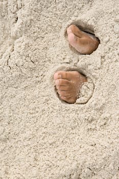 Feet under sand