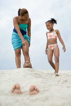 Father buried in the sand