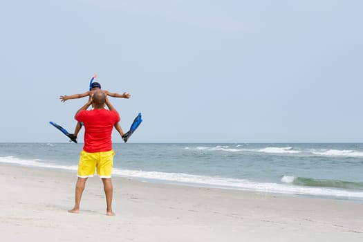 Father lifting son