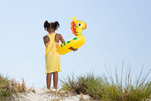Girl holding inflatable ring