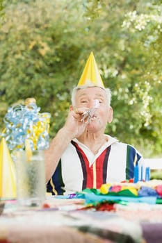Senior man at a birthday party