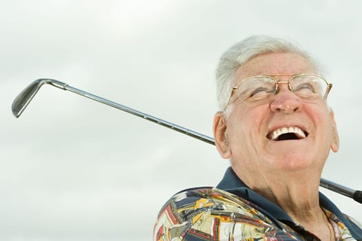 Senior man playing golf
