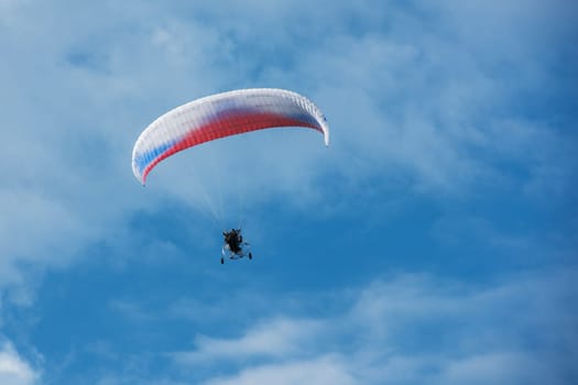 Paragliding in mountains. Para gliders in fight in the mountains, extreme sport activity.
