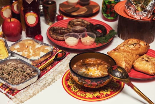 Table with traditional russian food decorated in russian style