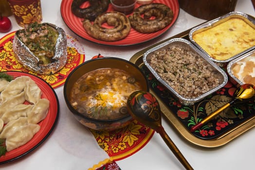 Table with traditional russian food decorated in russian style