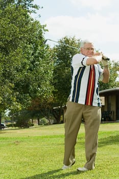 Senior man playing golf