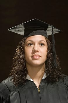 Female graduate looking up