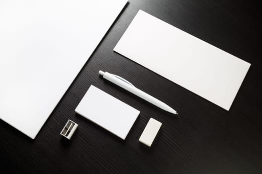 Blank stationery on black. Top view.