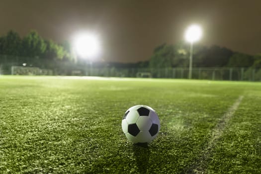 Soccer ball on sports field