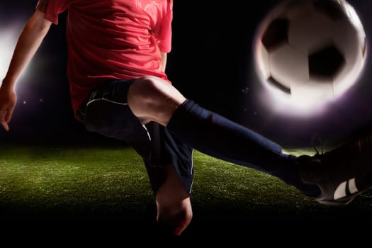 Soccer player kicking soccer ball