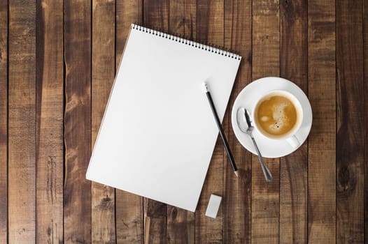 Notebook and coffee cup. Responsive design mockup.